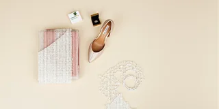 Bridal accessories and an appointment note arranged in a calm flatlay